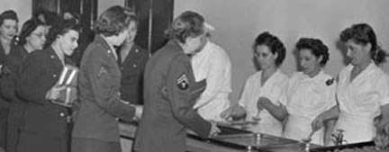 Photo of the WACs in line for dinner
