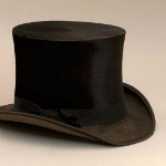 A black top hat with a curved brim