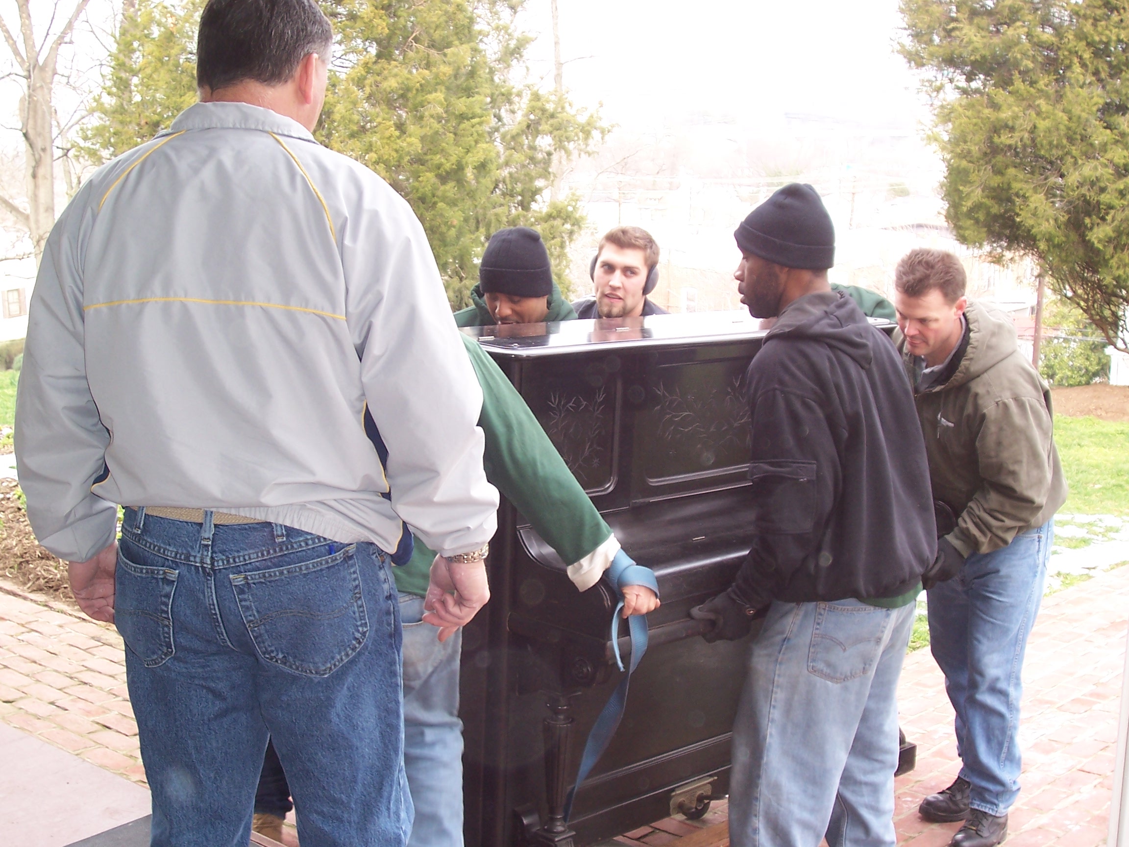Movers move Frederick Douglass' piano back into the house. Movers move Frederick Douglass' piano back into the house.
