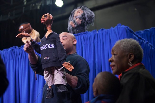 Puppeteers perform a show on Douglass's life.