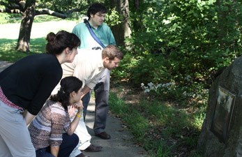 Four Interns reading a park plaque Four Interns reading a park plaque