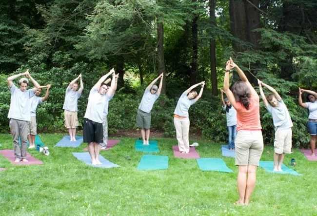 Adrienne Sharigian leading a yoga class on Fairsted's South Lawn.