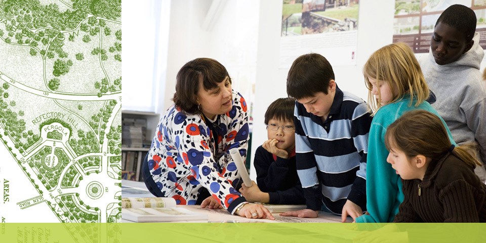 Landscape Architect shows a plan to students visiting her office