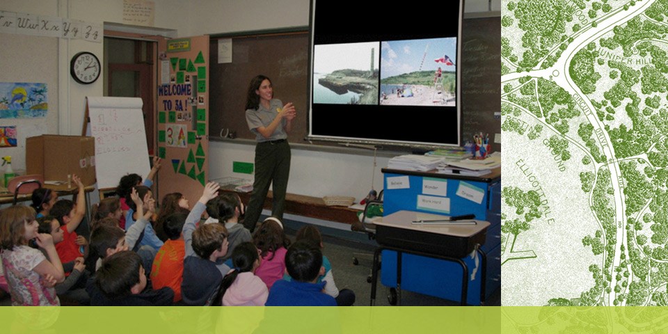 Park Ranger showing students a slide show as part of a Good Neighbors pre-vist