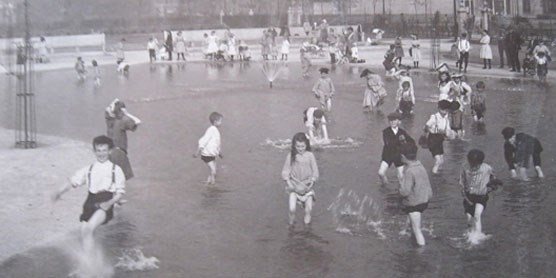 A c. 1910 photo of children playing in Washington Park in Chicago