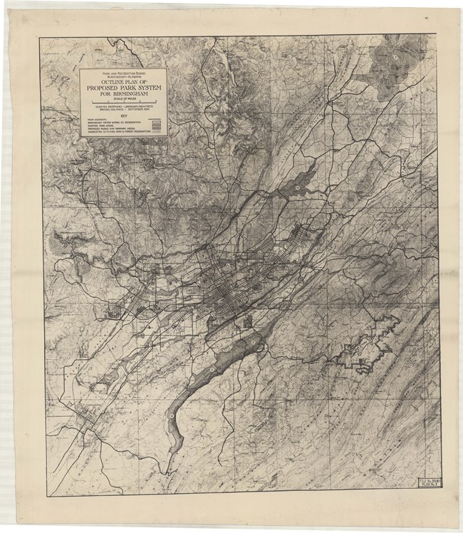 Large map with city grid and many streets and green spaces in a large city, with some major roads going through all green spaces.