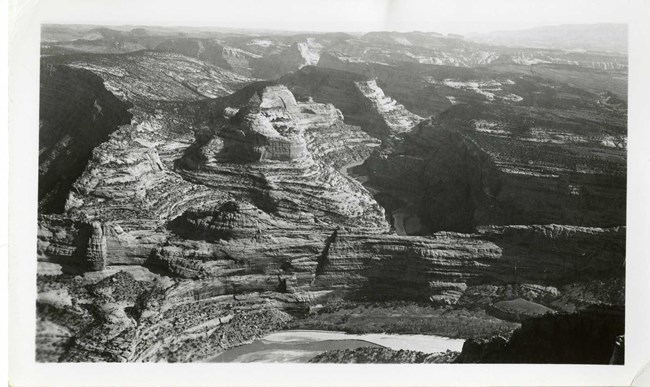 Black and white of many rocky mountains of different ledges