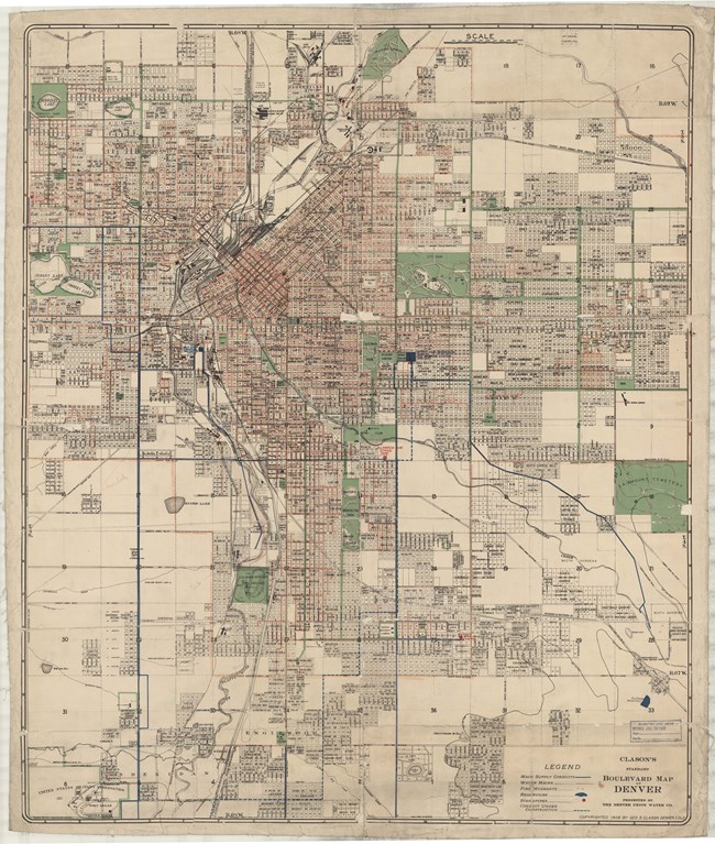 Map of city with many grid sections, large roads cutting through entire map, and many green spaces spread around the city.