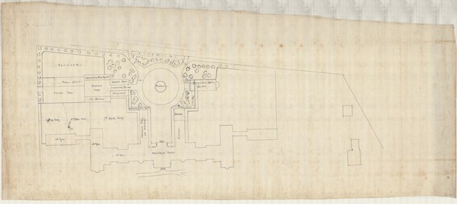 Pencil drawing of two straight roads making a right angle with a rotary leading to buildings inside and rectangular plots of land.