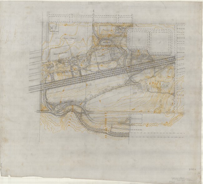 Pencil drawing of park plan with large road cutting right through it, and two sections on each side, with paths on both sides.