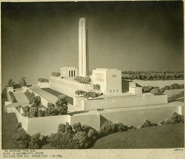 Model of large steps with plantings on the end, and at the middle, a large spire rises.