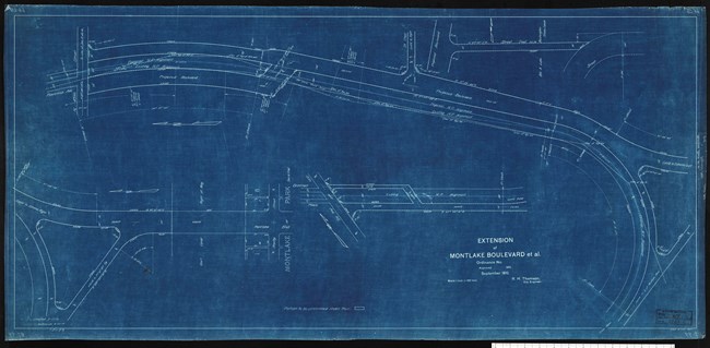 Blueprint of many roads, some straight some curved, with straight roads leading up to it