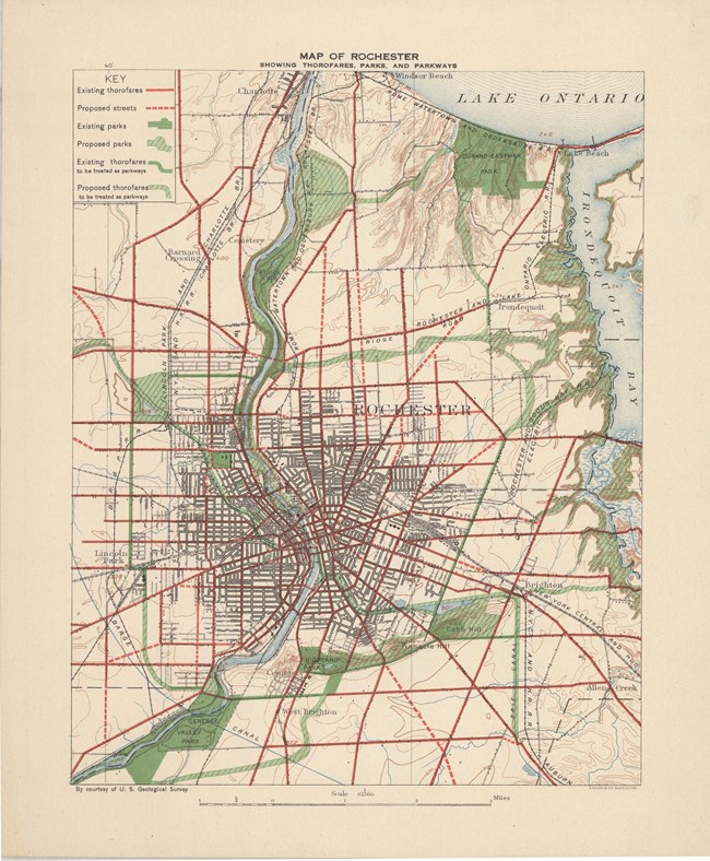 Map of city with hundreds of roads, major roads in straight red lines with many green spaces, all connected somehow