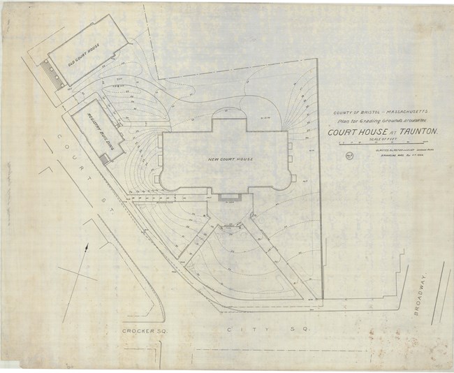 Pencil drawing of roads intersecting with three diagonal paths leading to symmentrical buildings with two other buildings on the land