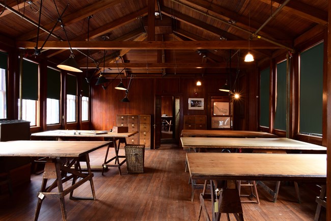 Large room with wooden desks