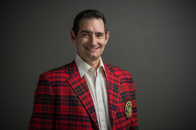 Man wearing red plaid jacket.