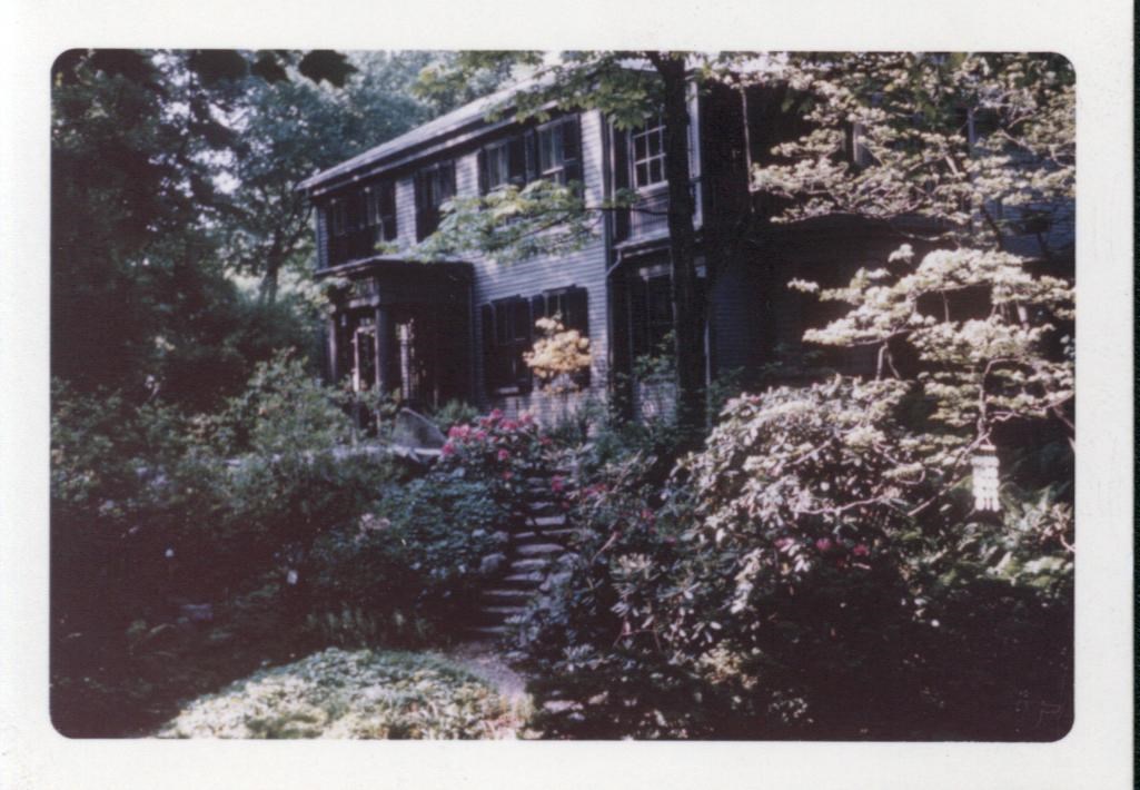 Historic house in the background with an extensive garden blooming in the foreground