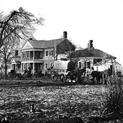 Black and white image of war damaged Chatham with wagon in front Black and white image of war damaged Chatham with wagon in front
