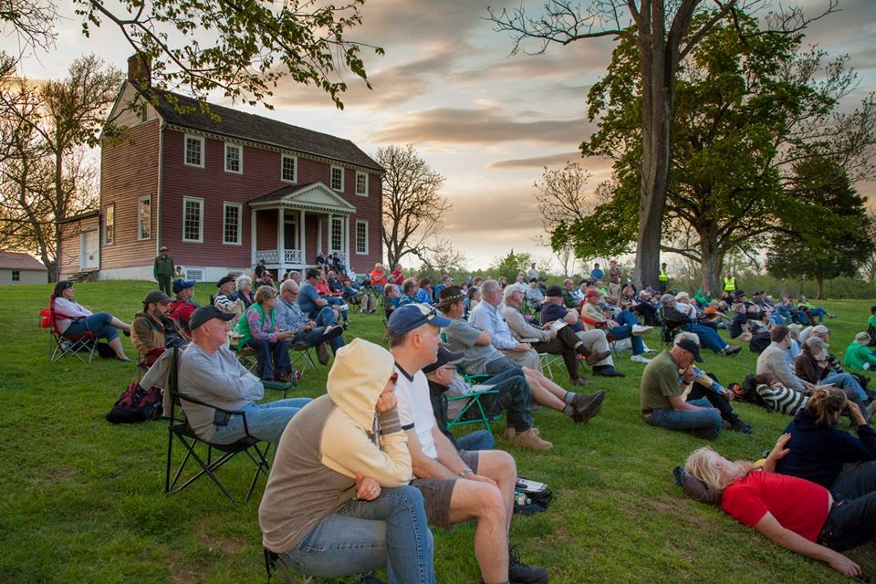 Visitors gather for an evening program with Ellwood Manor in background Visitors gather for an evening program with Ellwood Manor in background
