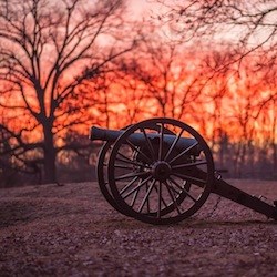 Cannon at Prospect Hill on the Fredericksburg battlefield illuminated by bright red sunset Cannon at Prospect Hill on the Fredericksburg battlefield illuminated by bright red sunset
