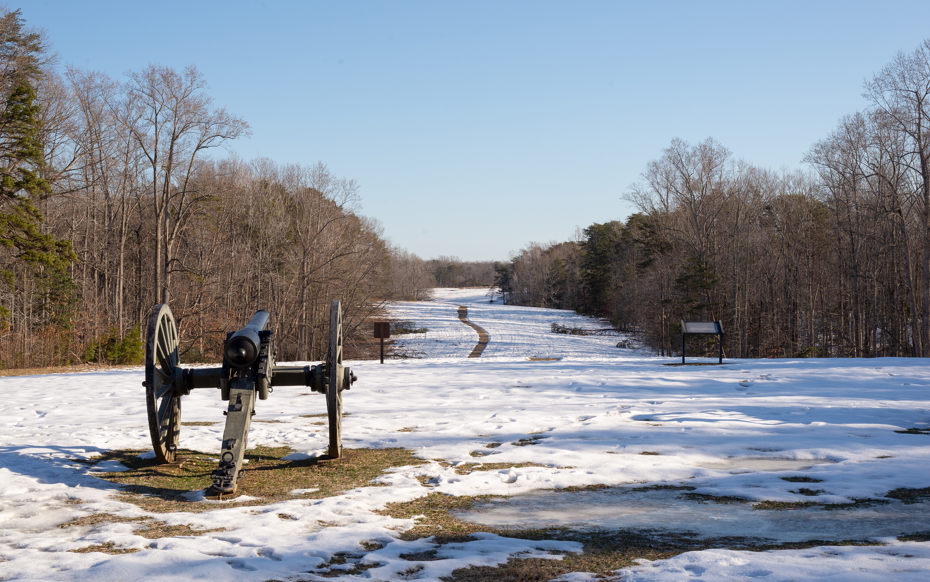 Hazel Grove in Winter A Civil War cannon points across a hill with a 2 inch layer of snow on the ground.