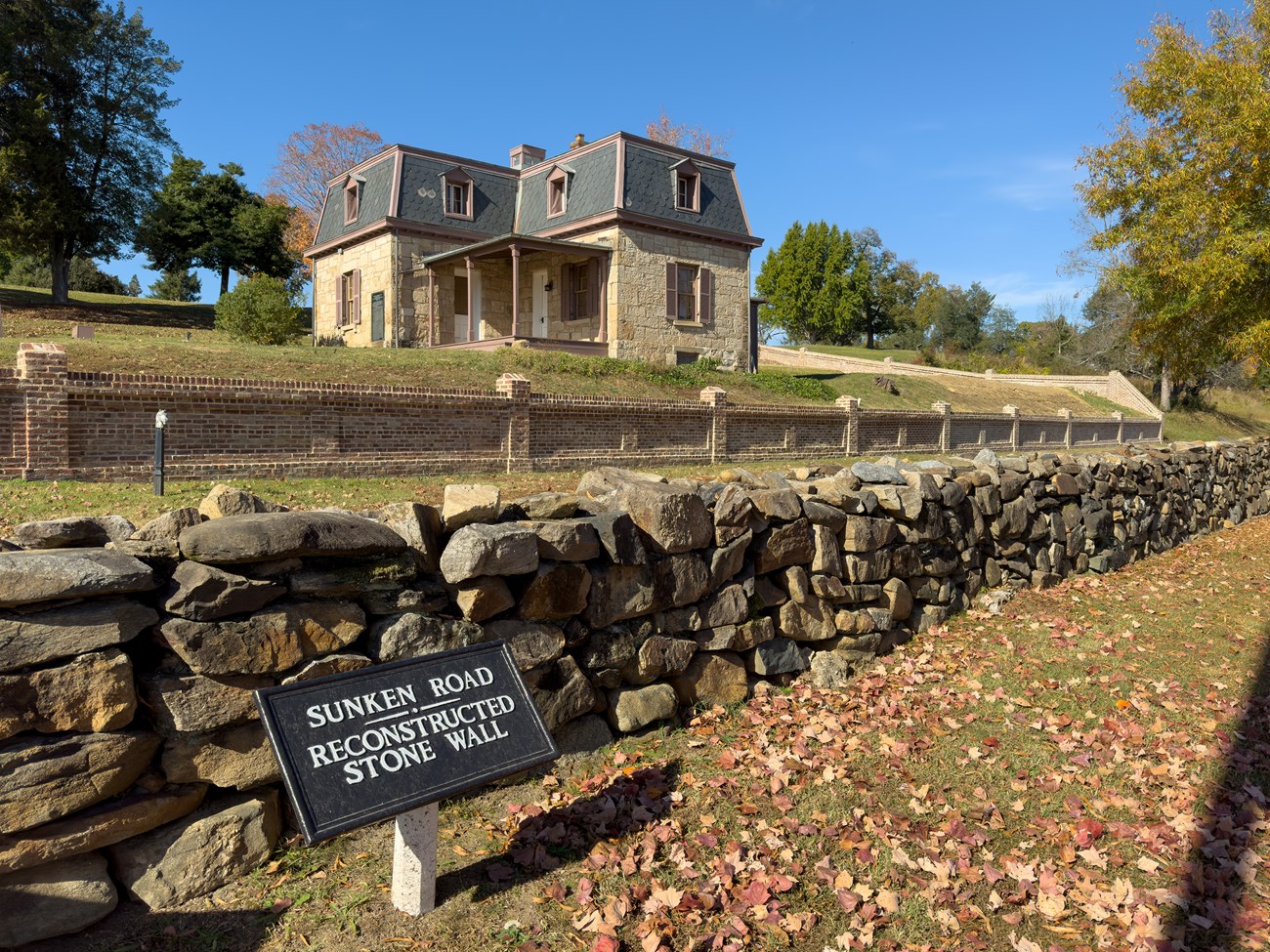 Cemetery Lodge with Garage Removed A view of Marye's Heights behind the Sunken Road with the Cemetery Lodge and an empty space where a building was reently demolished.
