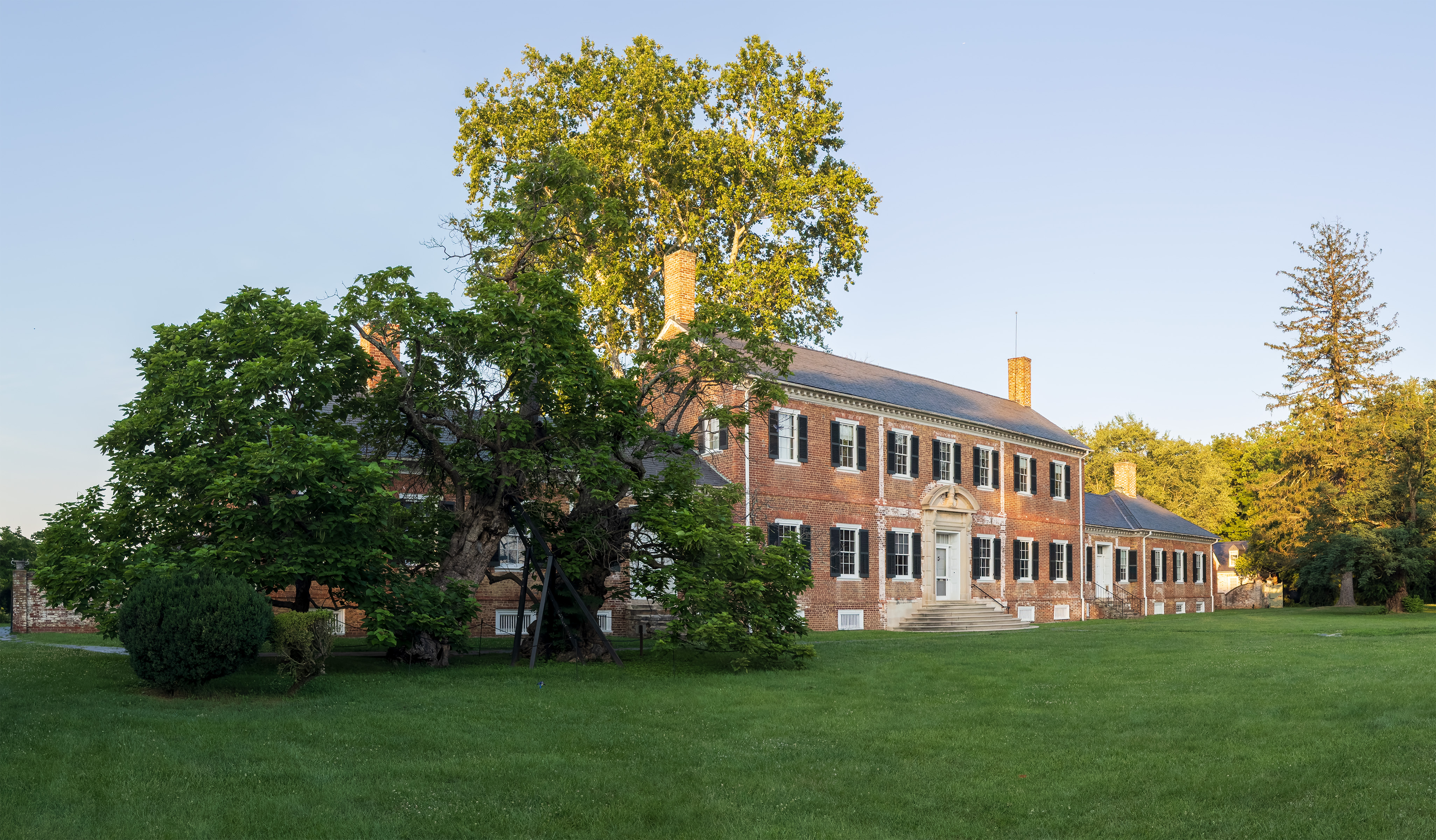 Chatham_Late Summer Golden sunset light across a the two-story Georgian brick building, Chatham Manor.