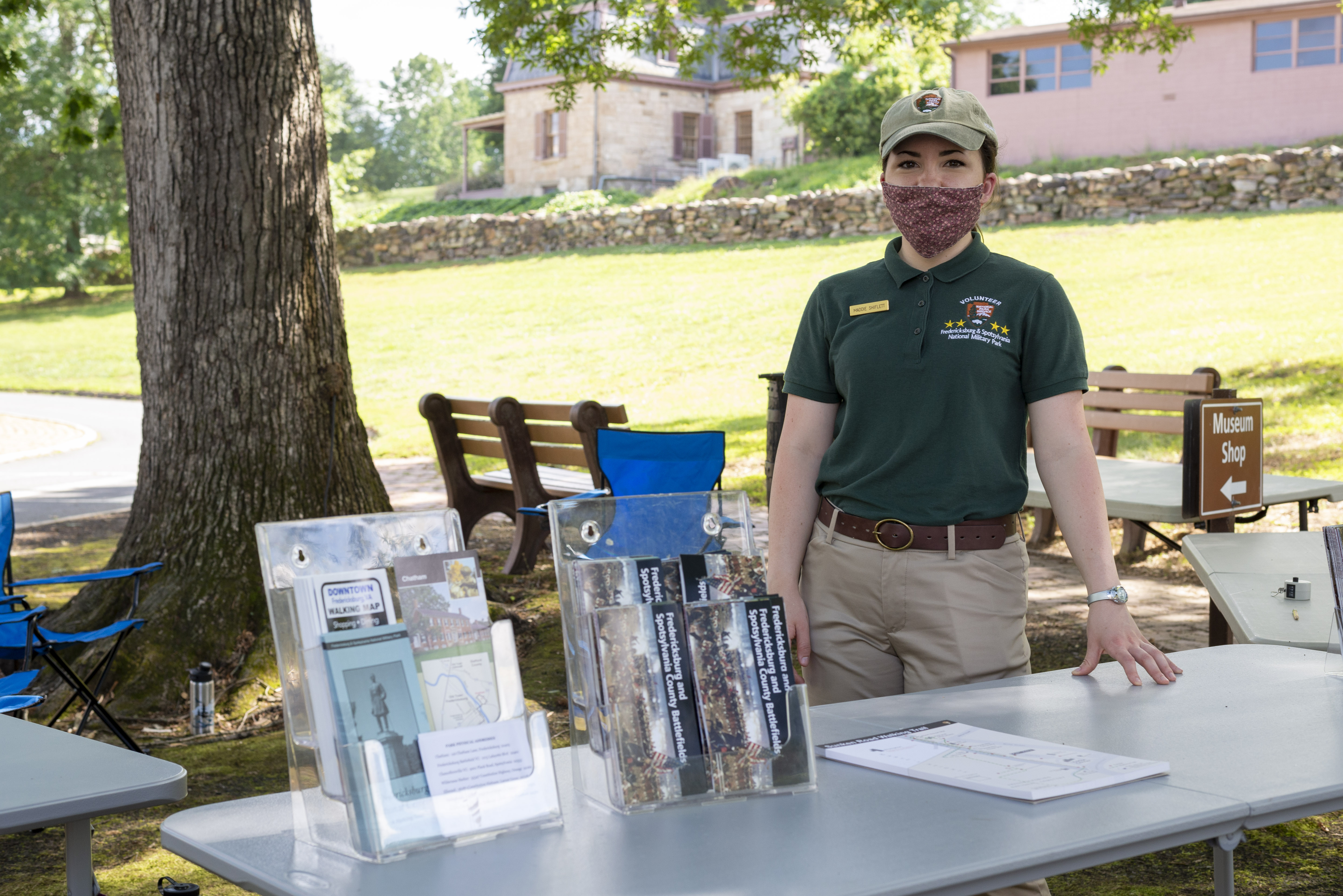 Outdoor Operations A park volunteer stands at an outdoor table.