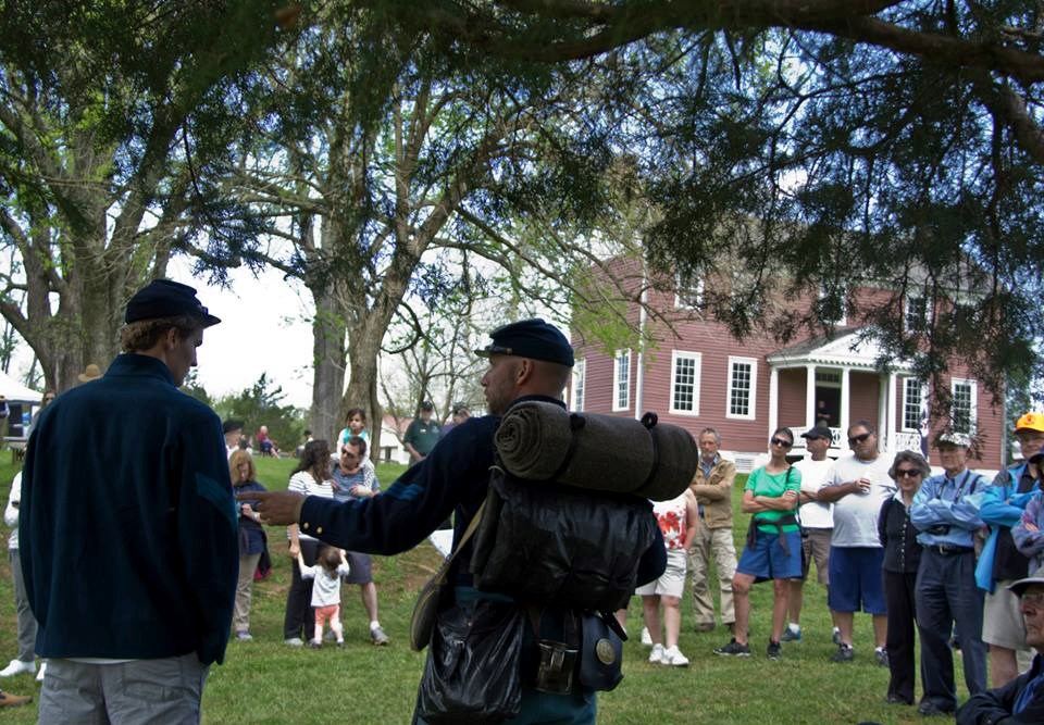 Reenactors at Ellwood Two living history reenactors in Union garb speak to visitors with Ellwood in background