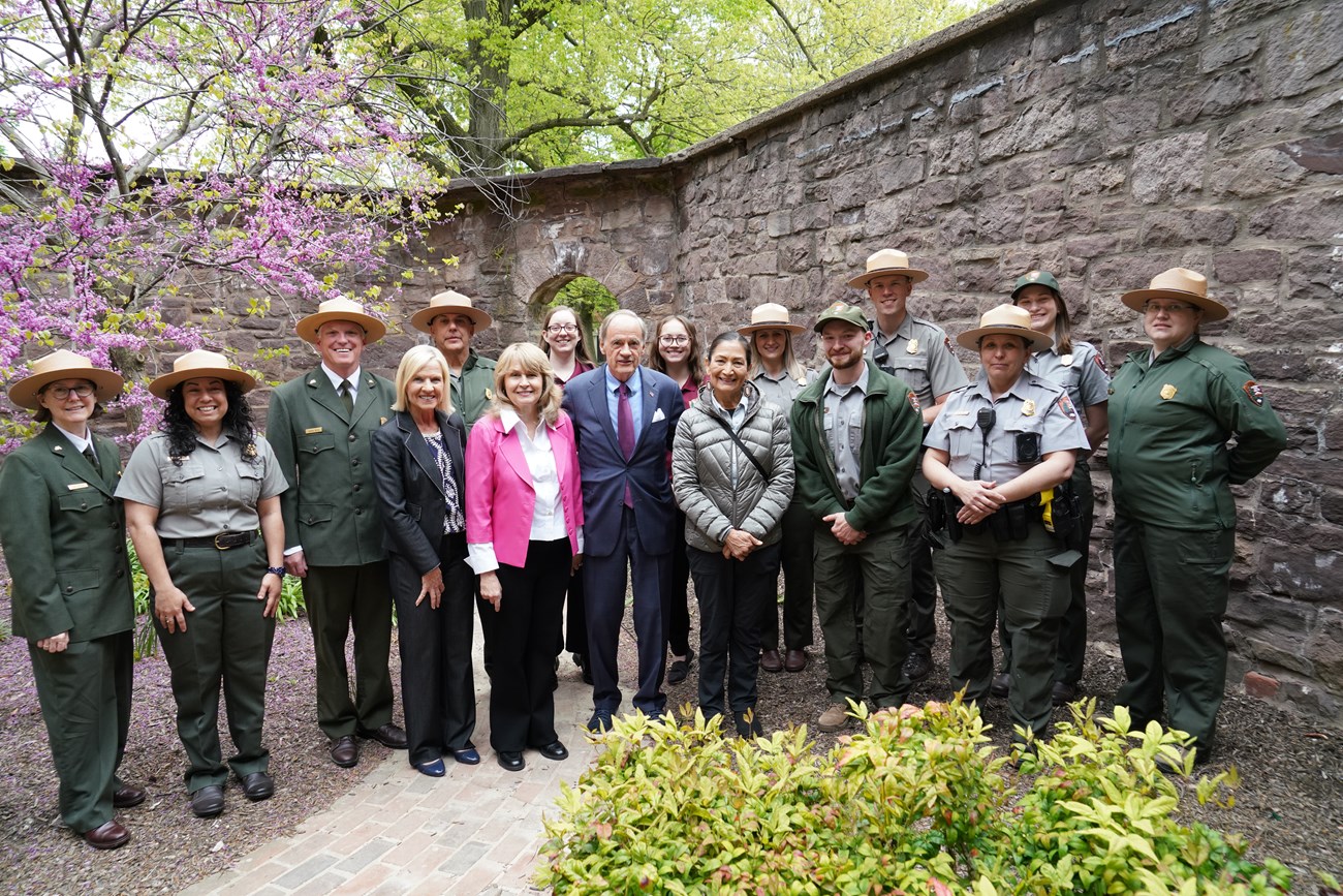 A group of Park Rangers pose for a photo with the DOI Secretary of the Interior and Deputy Lieutenant Governor.