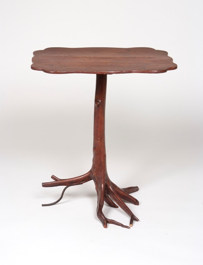 A handcrafted wooden table on a white background.