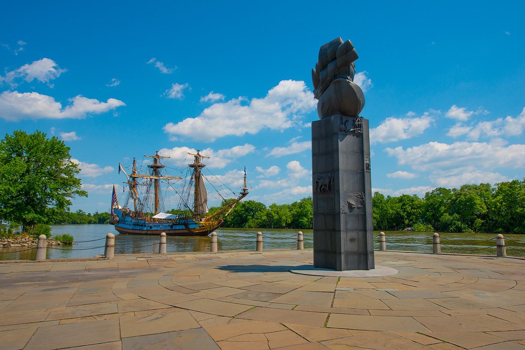 The monument at Fort Christina with the Kalmar Nyckel sailing in the background