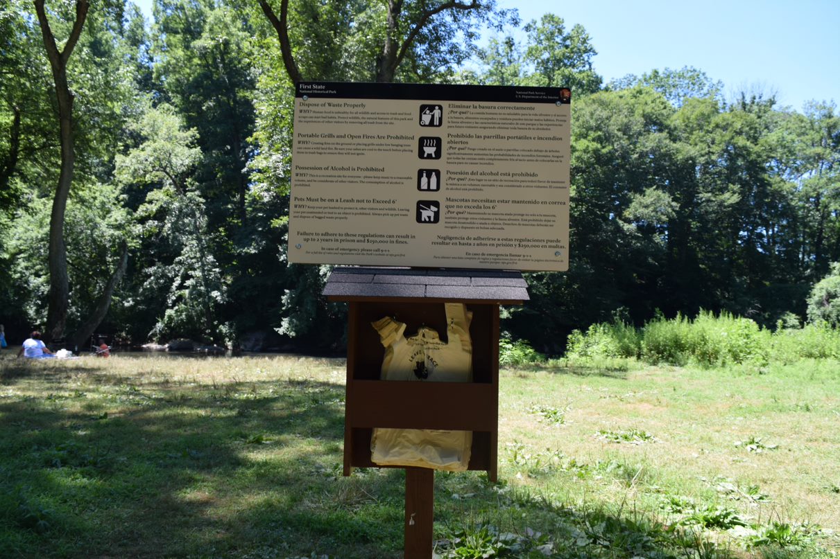 A sign showing park rules and regulations.