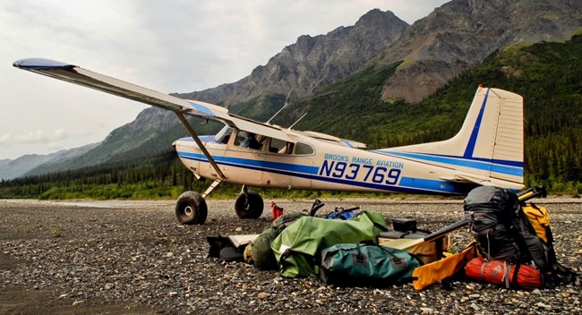 A bushplane on a gravel bar along the North Fork of the Koyukuk River, below Frigid Crags