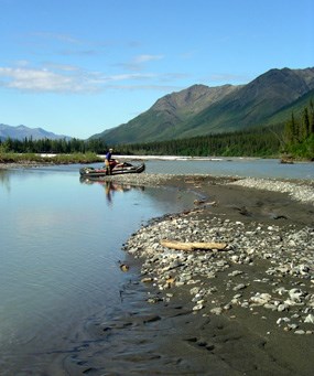 Loading the inflatable boat on the North Fork of the Koyukuk River. Loading the inflatable boat on the North Fork of the Koyukuk River.