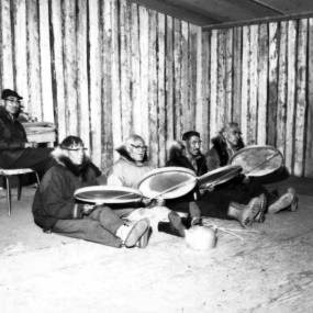 Men in Anaktuvuk Pass playing drums Men in Anaktuvuk Pass playing drums