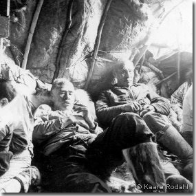 Maptigaq Morry and Inualuuraq Hugo relaxing inside a caribou skin house