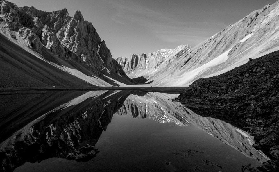 Black and white image of Hidden Valley reflection on a small lake in the Brooks Range