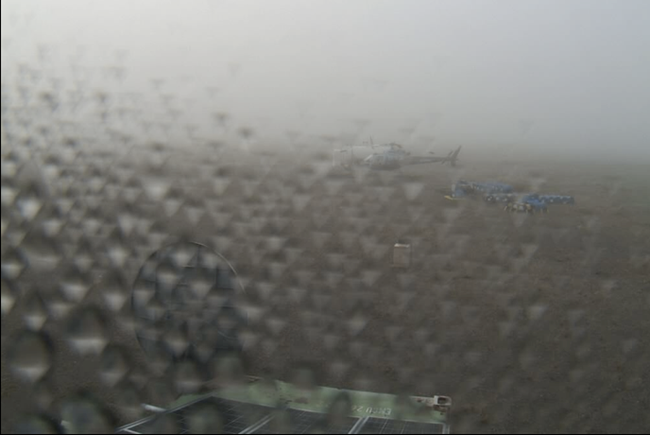 Webcam capture of low clouds and rain at Inigok Camp