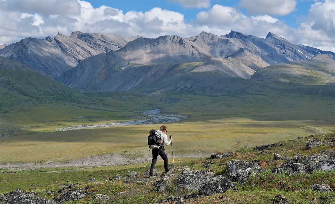 Backpacker in a mountain valley