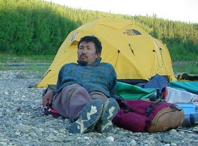 Relaxing at a gravel bar camp in the midnight sun. Relaxing at a gravel bar camp in the midnight sun.