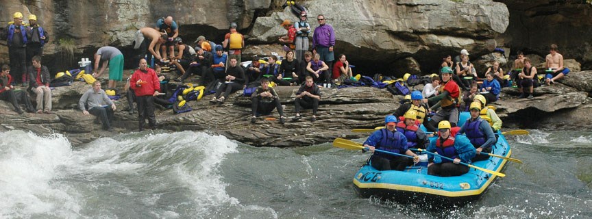 a crowd gathers to watch rafters run the rapids a crowd gathers to watch rafters run the rapids