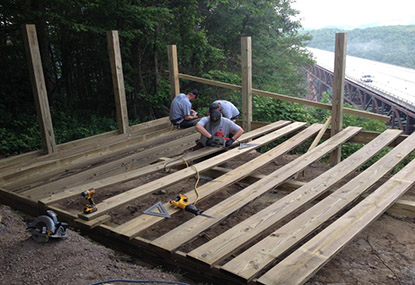 maintenance crew works on a boardwalk maintenance crew works on a boardwalk