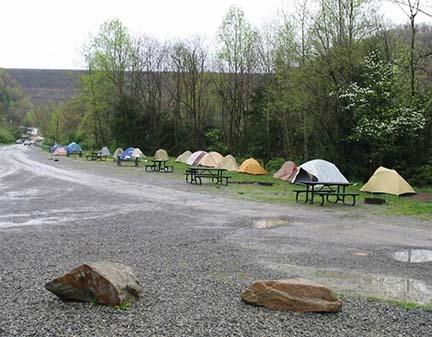 a row of tents alongside a parking lot a row of tents alongside a parking lot