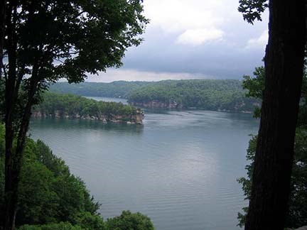 view of a lake with cliffs along shoreline