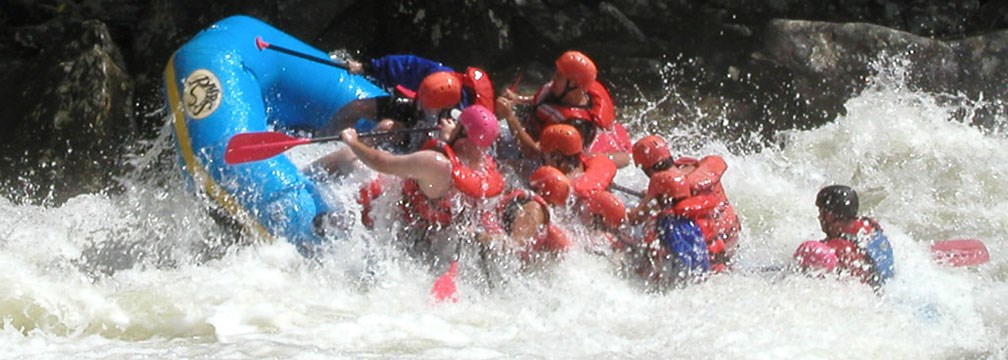rafters plunging through rapids