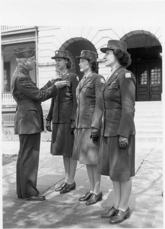 WACs receive good conduct medal.