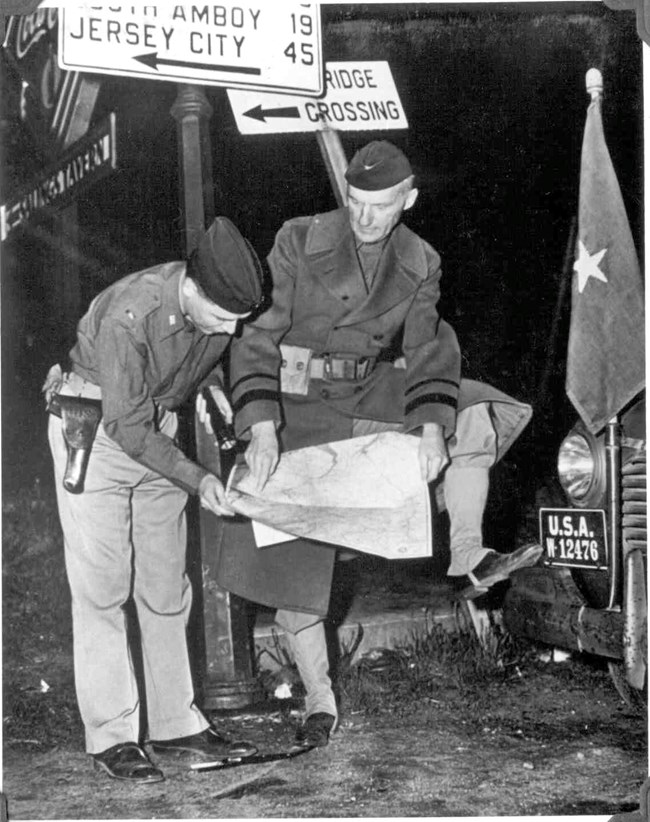 General Gage looking at a map.