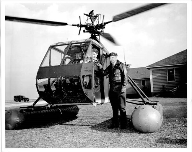 Photo of Frank Erickson and William Kessler in a helicopter