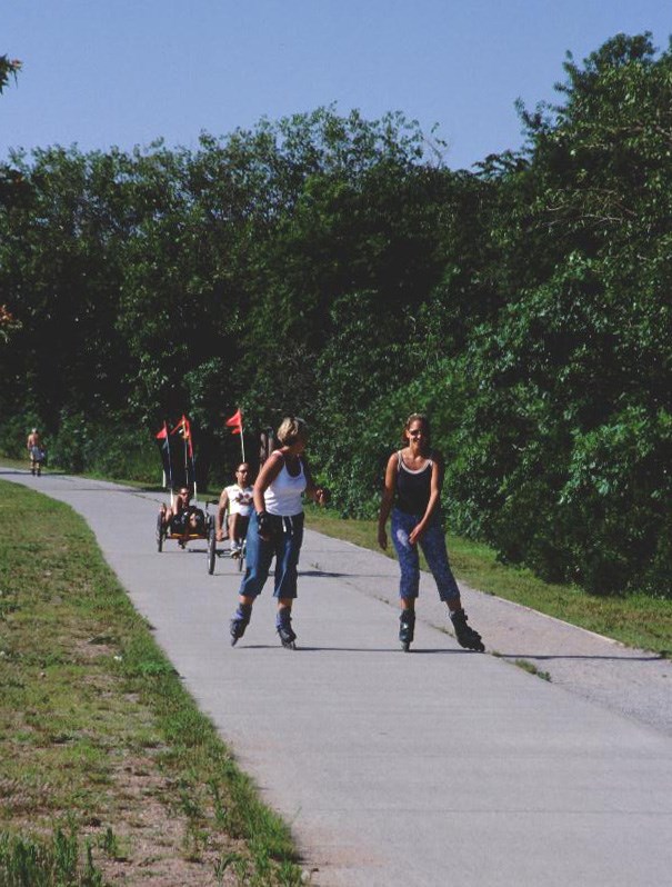 Roller blading and biking on the mutli use path at Great Kills Park